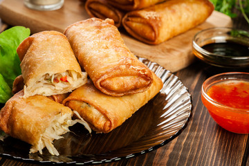 Spring rolls with chicken and vegetables served with sweet chili sauce or soy sauce
