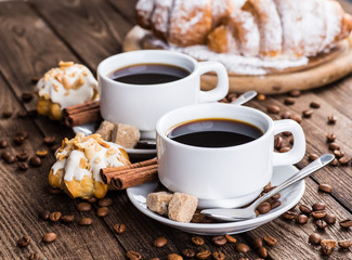 Two cups of espresso on brown napkin