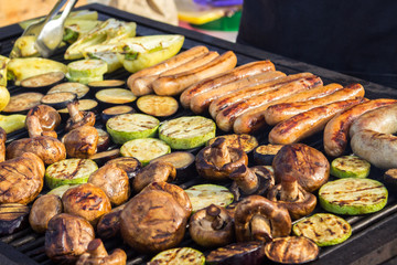 Assorted delicious grilled meat with vegetable over the coals on a barbecue