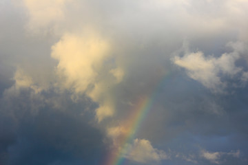 Evening sky after rain, rainbow goes into the cloud,a Fabulously beautiful sky. Rainbow in the sky..