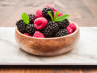 Wooden cup with fresh berries