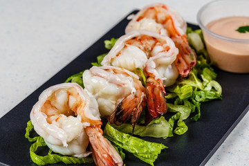 cooked shrimps on black slate