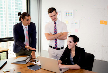 Business team having using laptop during a meeting and presents.