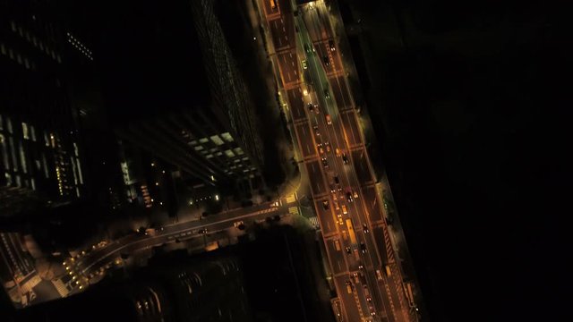 Japan Tokyo Aerial v51 Vertical view flying low over highway at night