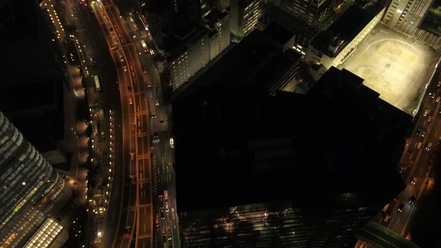 Japan Tokyo Aerial v52 Vertical shot panning up to cityscape views in Ginza area night 2/17