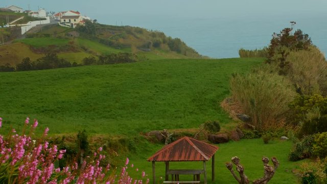 The Farol Ponta do Arnel lighthouse in the Nordeste city, Sao Miguel, The Azores, Portugal seen from the Ponta do Sossego lookout