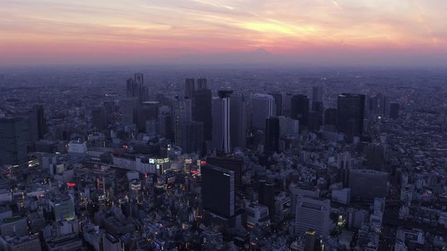 Japan Tokyo Aerial v62 Flying over Shinjuku area with cityscape views at dusk 2/17