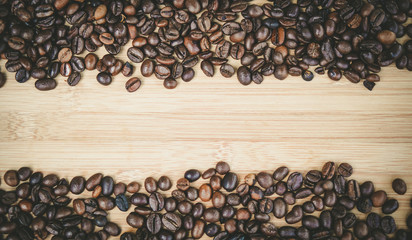 coffee beans on wooden table for background