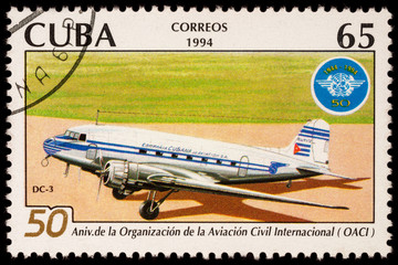 Old passenger aircraft DC-3 on postage stamp