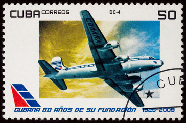 Passenger aircraft Douglas DC-4 on postage stamp
