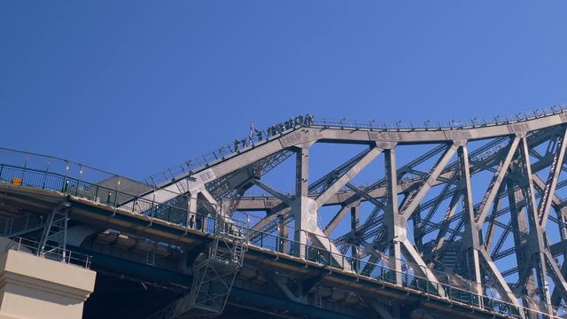 The Story Bridge Adventure Climb is a panoramic group walk in safety harnesses across the top of Brisbane's iconic cantilever bridge. 