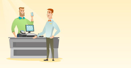 Man paying wireless with a smartphone.