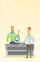 Man paying wireless with a smartphone.