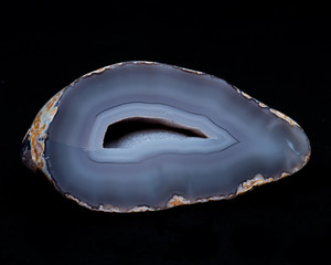 Partially polished blue lace agate geode with crystaline druzy center isolated on white background