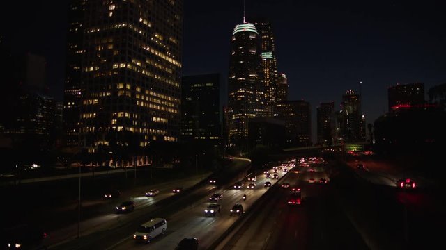 Freeway traffic in downtown Los Angeles at night. Evening Rush Hour Traffic. 4K