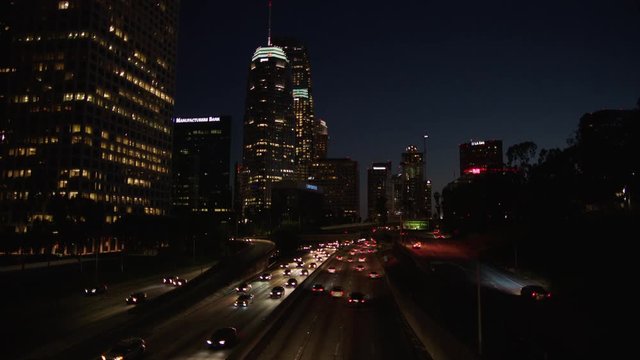Freeway traffic in downtown Los Angeles at night. Evening Rush Hour Traffic. 4K