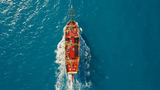Aerial top down view of the party boat sailing ship at sea