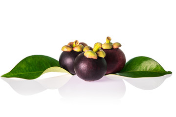 three mangosteen isolated on white background.tropical fruit for healthy eating.