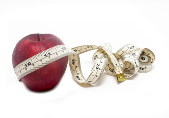 Red Apple And Measure Tape Isolated On White Background.
