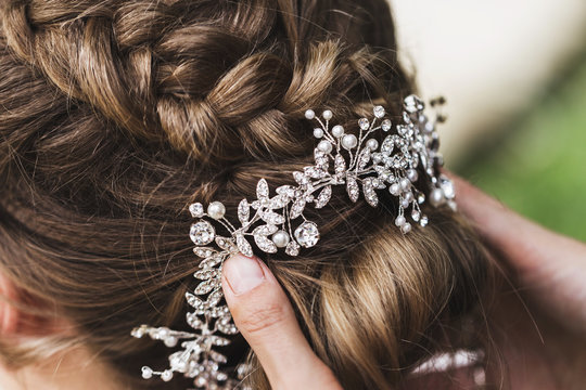 Hairpin in the bride's hair, wedding hairstyle with accessories with jewelery