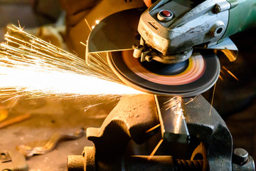 Cutting metal grinding machine, spark. - obrazy, fototapety, plakaty