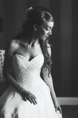 Beautiful black and white portrait of young woman in wedding dress