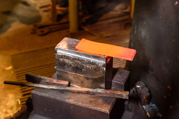 Forging molten metal. Making knives.