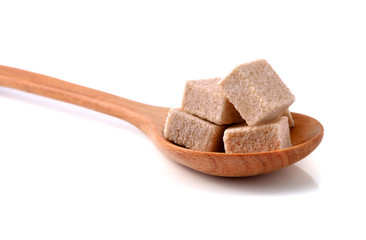 brown sugar cube isolated on white.