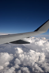 Airplane wing above the clouds