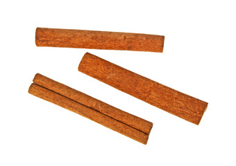 Top view of cinnamon sticks isolated on white