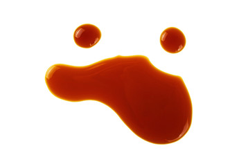 Puddle of soy sauce on white background