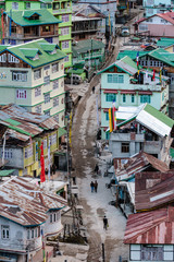 Fototapeta premium Colorful mountain's village in the afternoon with people on the street in winter at Lachen in North Sikkim, India.