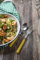 Green tagliatelle with seafood. Mussels; Prawns