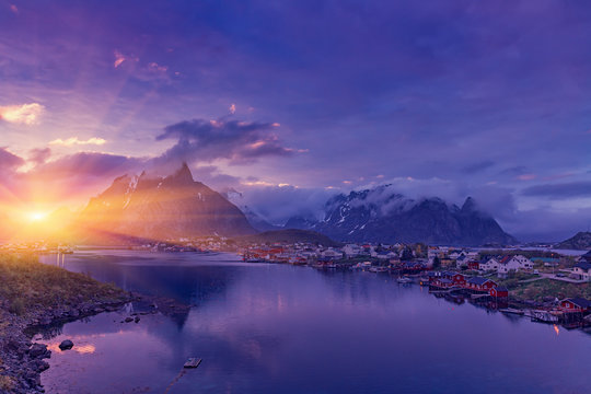 The Typical Norwegian fishing village of Reine under midnight sun