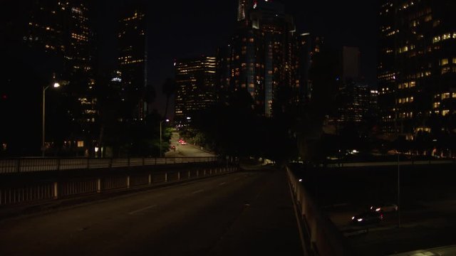 Freeway traffic in downtown Los Angeles at night. Evening Rush Hour Traffic. 4K