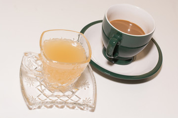 .Ginger juice and coffee ready to drink in the morning. Put on white floor