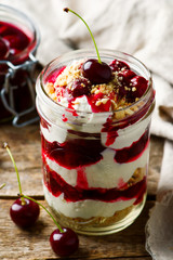 cherry cheesecake in a  jar.style rustic