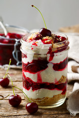 cherry cheesecake in a  jar.style rustic