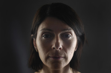 portrait of a woman on black background