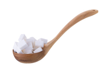 Sugar cubes in wooden spoon isolated on a white background