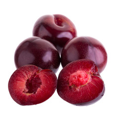 Obraz premium ripe fresh plum with half and slice isolated on white background