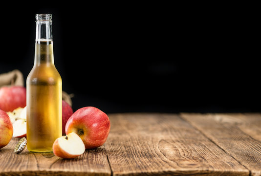 Apple Cider (selective focus) on vintage wooden background