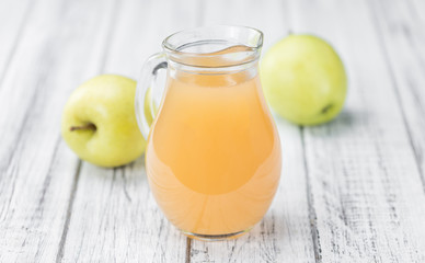 Apple Juice on vintage wooden background