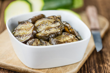 Grilled Zucchinis (selective focus) on vintage wooden background