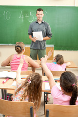 Elementary School Students at Classroom Desks
