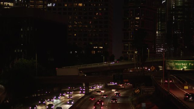 Freeway traffic in downtown Los Angeles at night. Evening Rush Hour Traffic. 4K