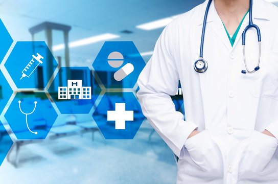 smart doctor with a stethoscope around his neck on blurred image of empty chairs in waiting room at hospital and medical icon in hexagon shaped pattern design, healthcare medical technology concept