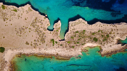 Aerial drone photo of Glaronisi island with clear turquoise waters, Cyclades, Greece