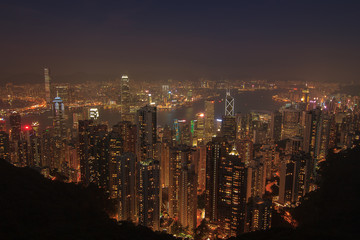 Evening aerial view panorama of Hong Kong skyline and Victoria Harbor. Travel destinations.