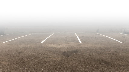 Painted parking lot car park and fog, bays shot. Empty parking lot. © Zenzeta